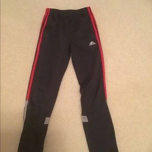 Red and grey adidas pants